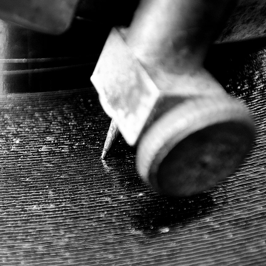 close-up of shellac disc being played, showing grooves